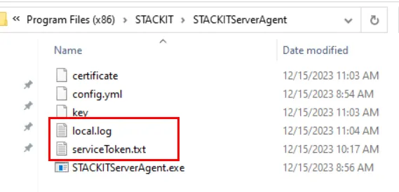 Windows File Explorer view of the STACKITServerAgent directory, highlighting the 'local.log' and 'serviceToken.txt' files.